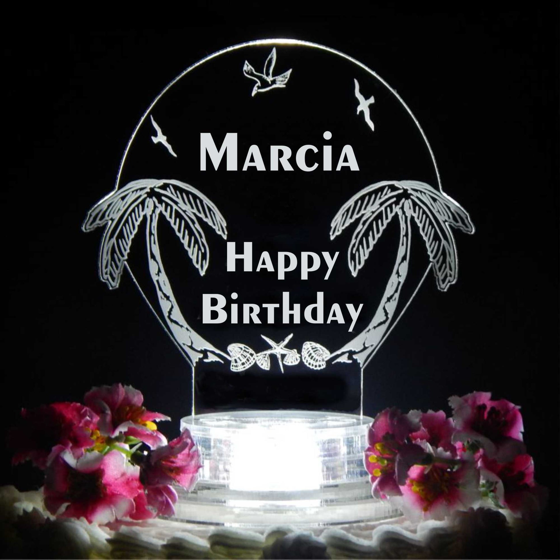 acrylic cake topper designed with palm trees and seagulls, with Happy Birthday and name engraved