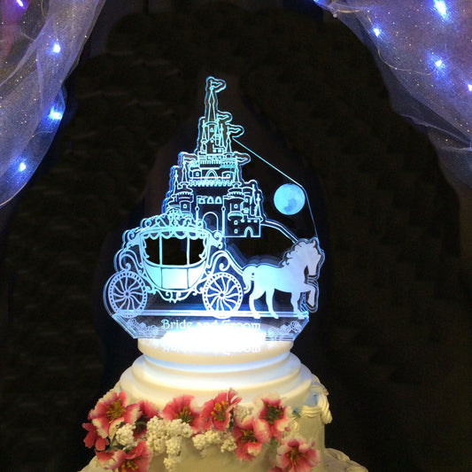 acrylic castle and carriage cake topper lit up with bride and groom name