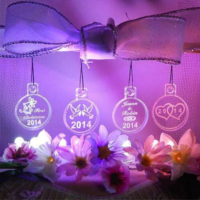 acrylic round ornaments shown with wedding rings design on one, hearts on one, wedding bells on one, and doves on the last