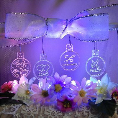 clear round acrylic ornaments one with a thenk you message, one with hearts, one with a friendship symbol, and one with a dove