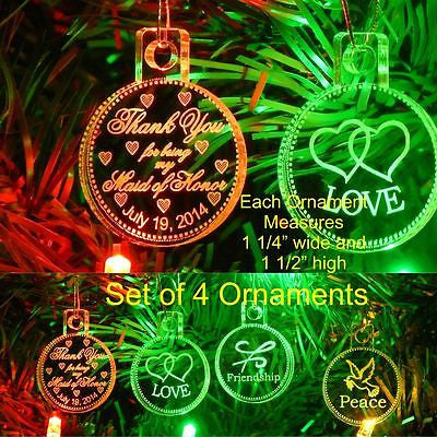 clear round acrylic ornaments one with a thenk you message, one with hearts, one with a friendship symbol, and one with a dove