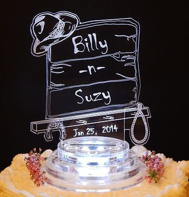 acrylic cake topper in western backboard shape with cowboy hat and rack for horseshoe and horse lasso rope