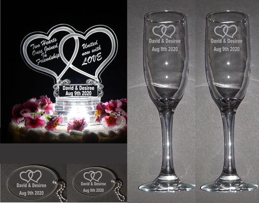 wedding package showing an acrylic heart shaped cake topper, large and small keychain favors, and set of two champagne flutes