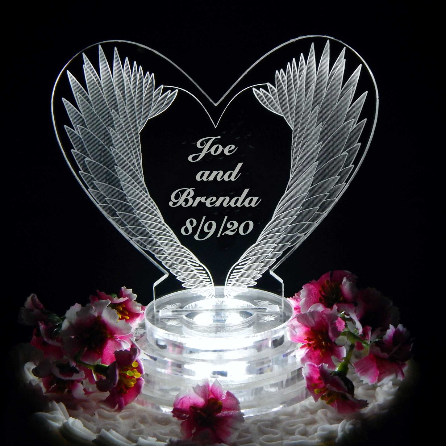 acrylic heart shaped cake topper designed with angel wings and engraved with names and date