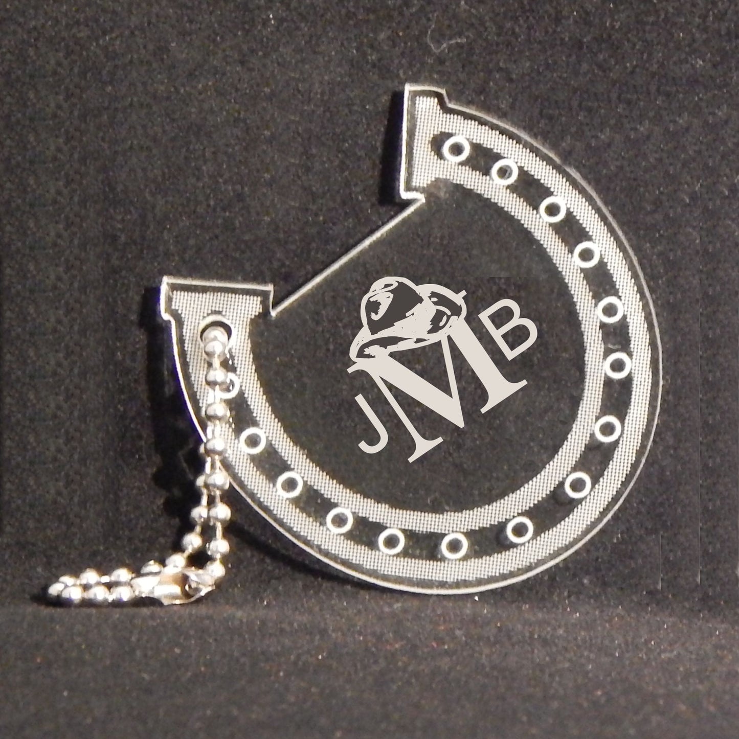 horseshoe shaped acrylic keychain designed with a horseshoe design and engraved with monogram