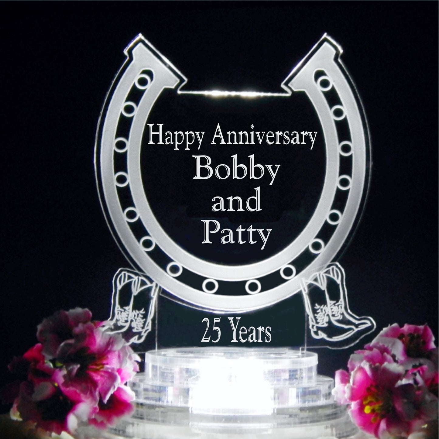 horseshoe shaped acrylic cake topper designed with a horseshoe design and engraved with names and Happy Anniversary