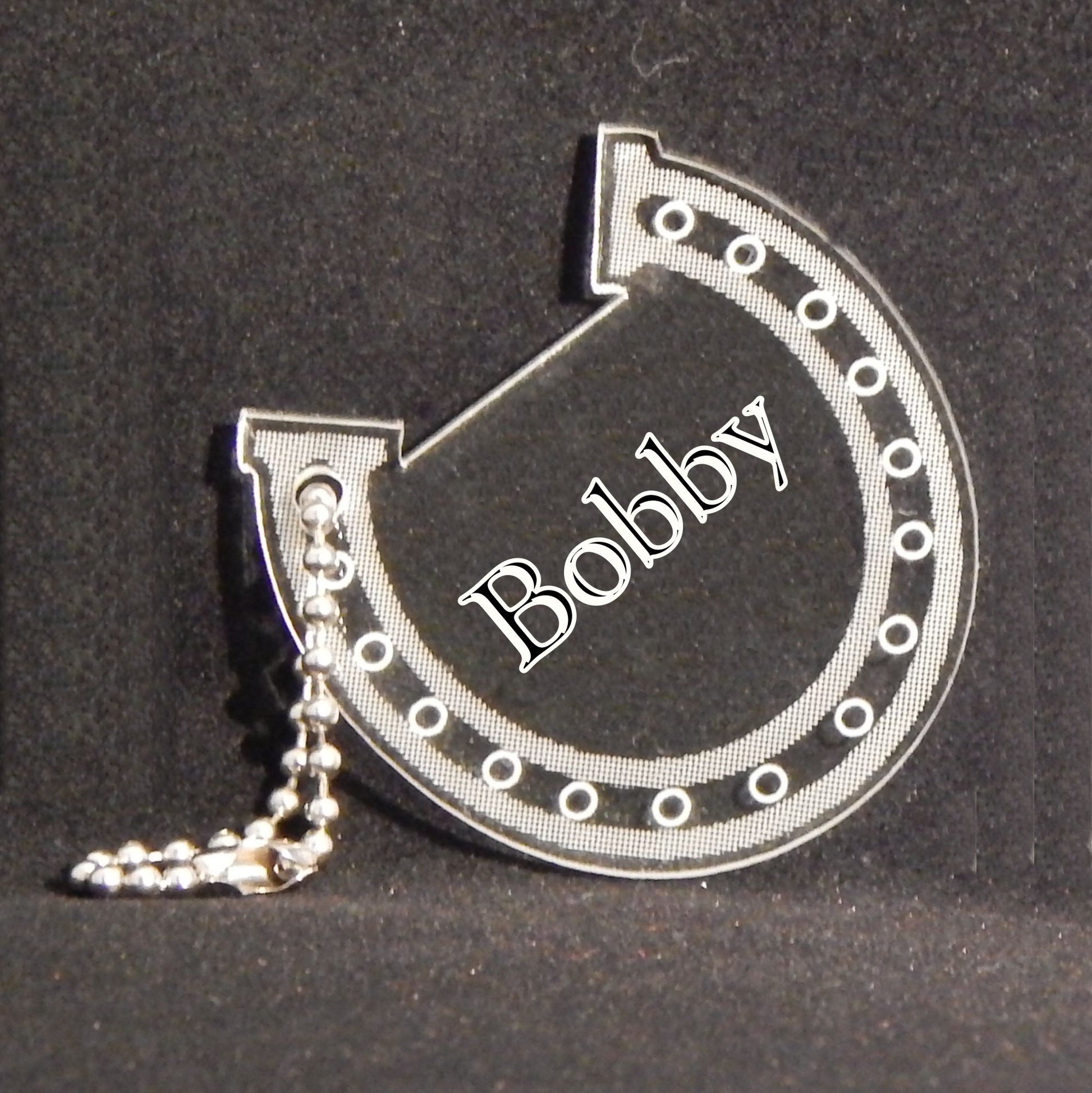 horseshoe shaped acrylic keychain designed with a horseshoe design and engraved with name