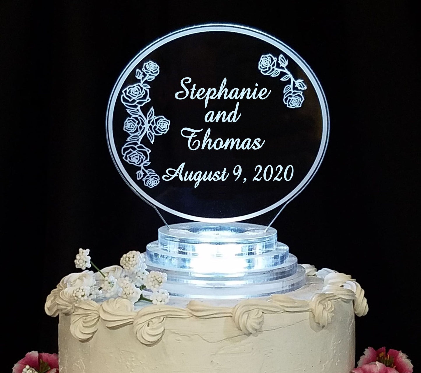 clear acrylic cake topper designed in a rose and rosebud theme,  engraved with names and date