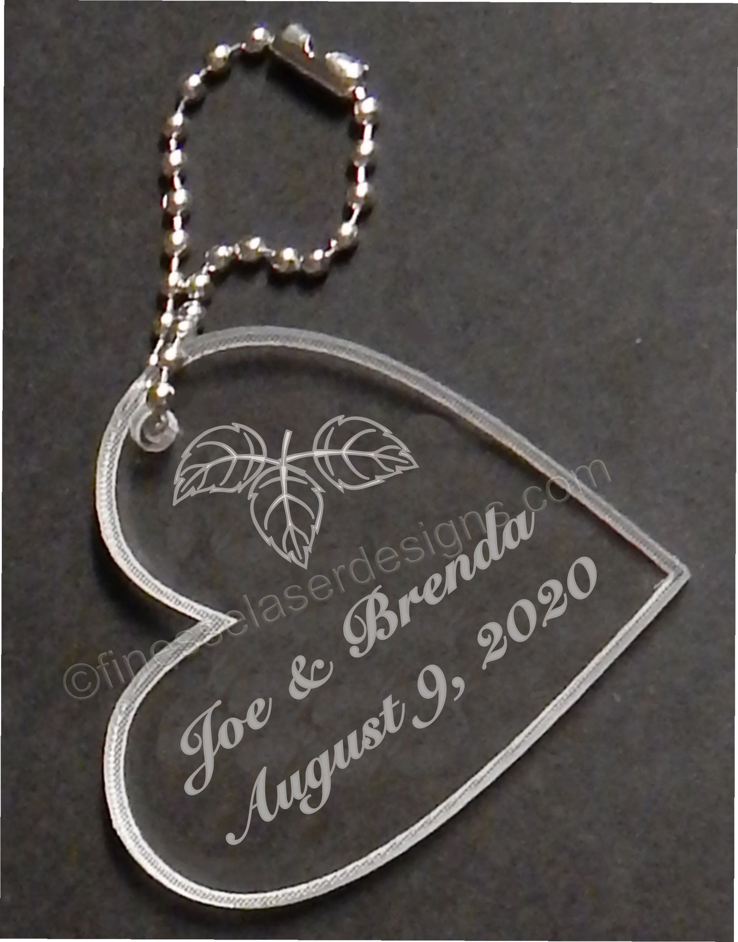 acrylic heart shaped keychain designed with fall leaves and engraved with names and date