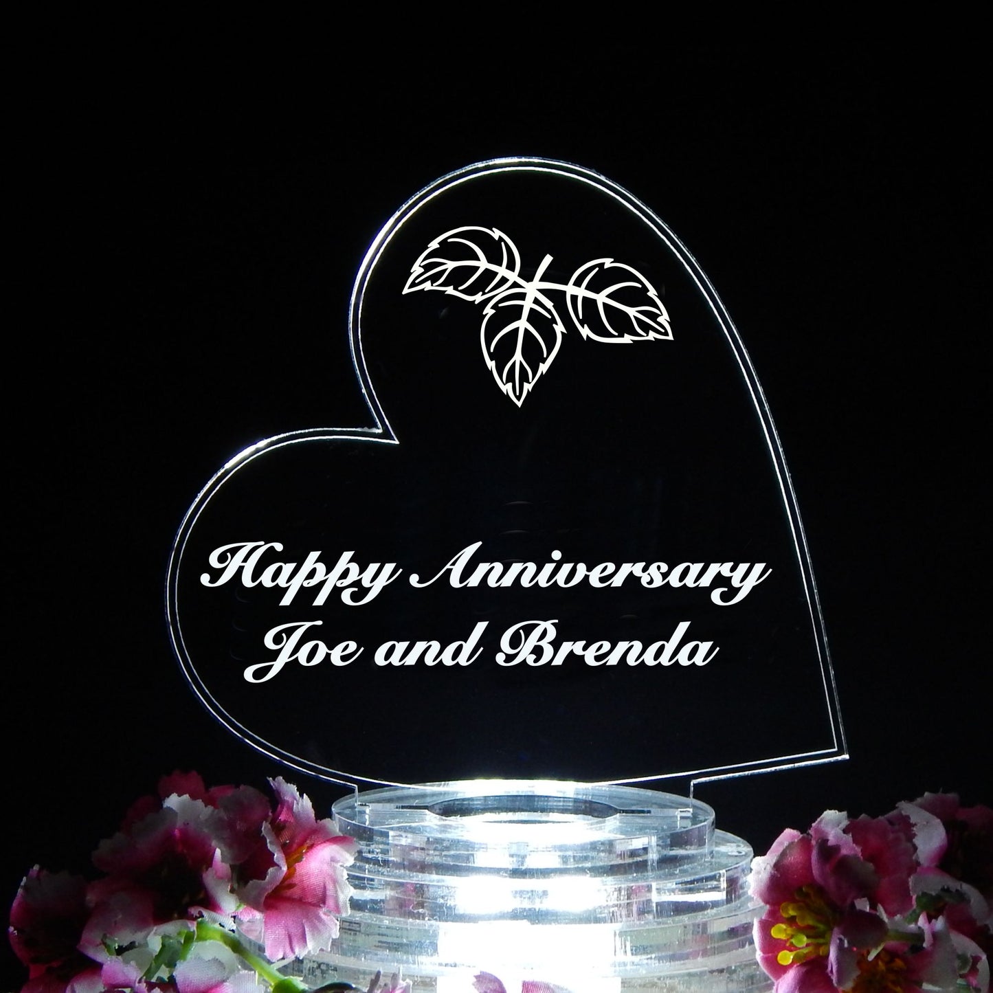 heart shaped cake topper designed with fall leaves and engraved with Happy Anniversary and names