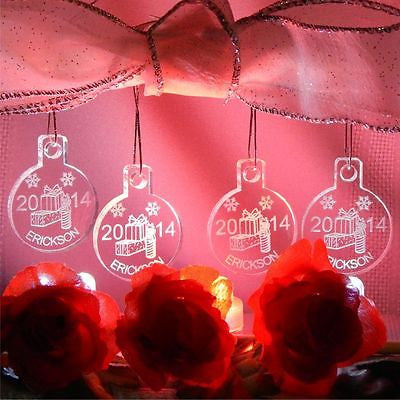 Set of 4 acrylic round ornaments with gift boxes designed along with a name and year