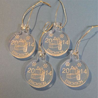 set of 4 acrylic round ornaments with gift boxes designed along with a name and year