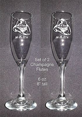 two champagne flutes with a cowboy had design engraved on flute