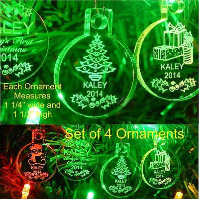 acrylic round miniature ornaments shown with Christmas tree, gift boxes, teddy bear and holly design. Name and Year included
