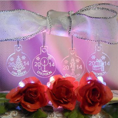 acrylic round ornaments shown hanging- Christmas tree, candle, gift box and nutcracker design