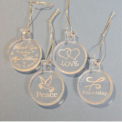 clear round acrylic ornaments one with a thenk you message, one with hearts, one with a friendship symbol, and one with a dove