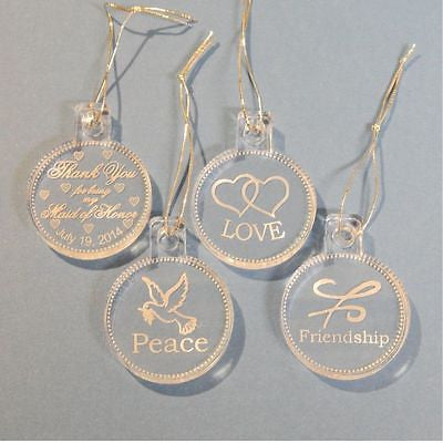 clear round acrylic ornaments one with a thenk you message, one with hearts, one with a friendship symbol, and one with a dove