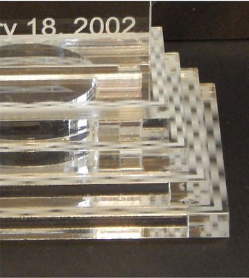 partial view of rectange acrylic tiered base for a cake topper