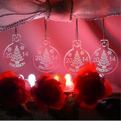 Set of 4 acrylic round ornament showing a Christmas tree design along with Last name and year