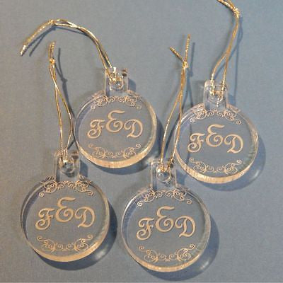 4 acrylic round ornaments with 3 letter monogram and pretty design engraved