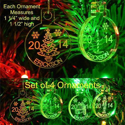 acrylic round ornaments shown hanging on tree, with Christmas trre, candle, gift box and nutcracker design