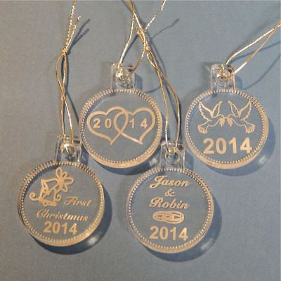 acrylic round ornaments shown with wedding rings design on one, hearts on one, wedding bells on one, and doves on the last
