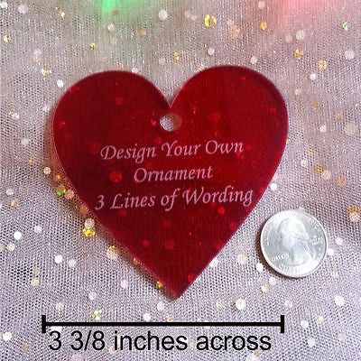 red heart shaped ornament with 3 lines of wording, shown alongside a quarter to show size