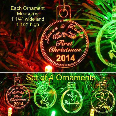 acrylic ornaments showing 4 designs with names and holly on one, Peace and dove on another, Friendship with oriental writing, and Love with two hearts