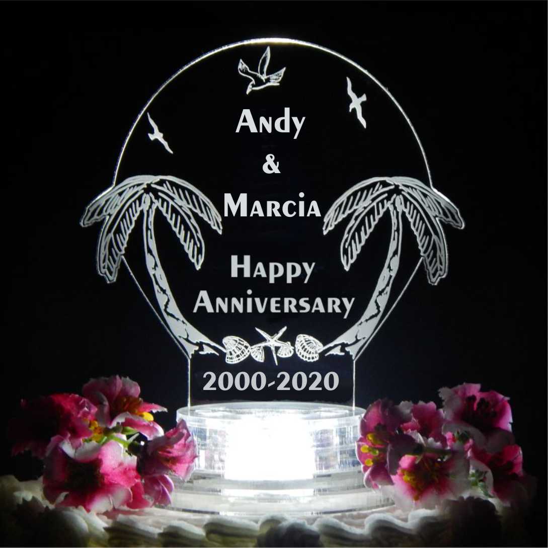 acrylic beach themed cake topper designed with palm trees along with names, Happy Anniversary and date information