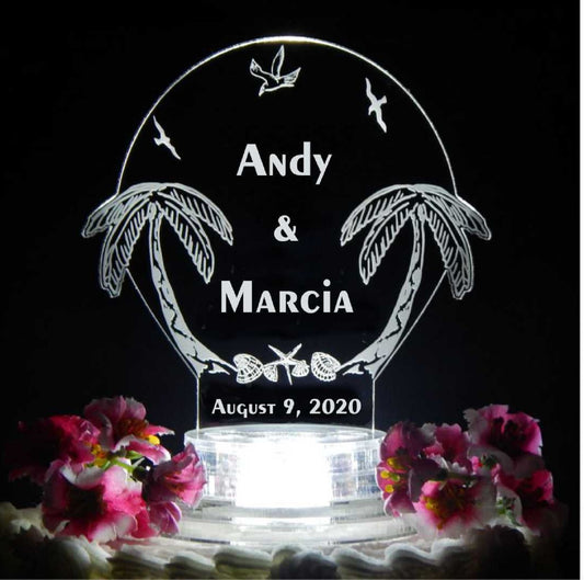 acrylic cake topper designed with palm trees along with names and date