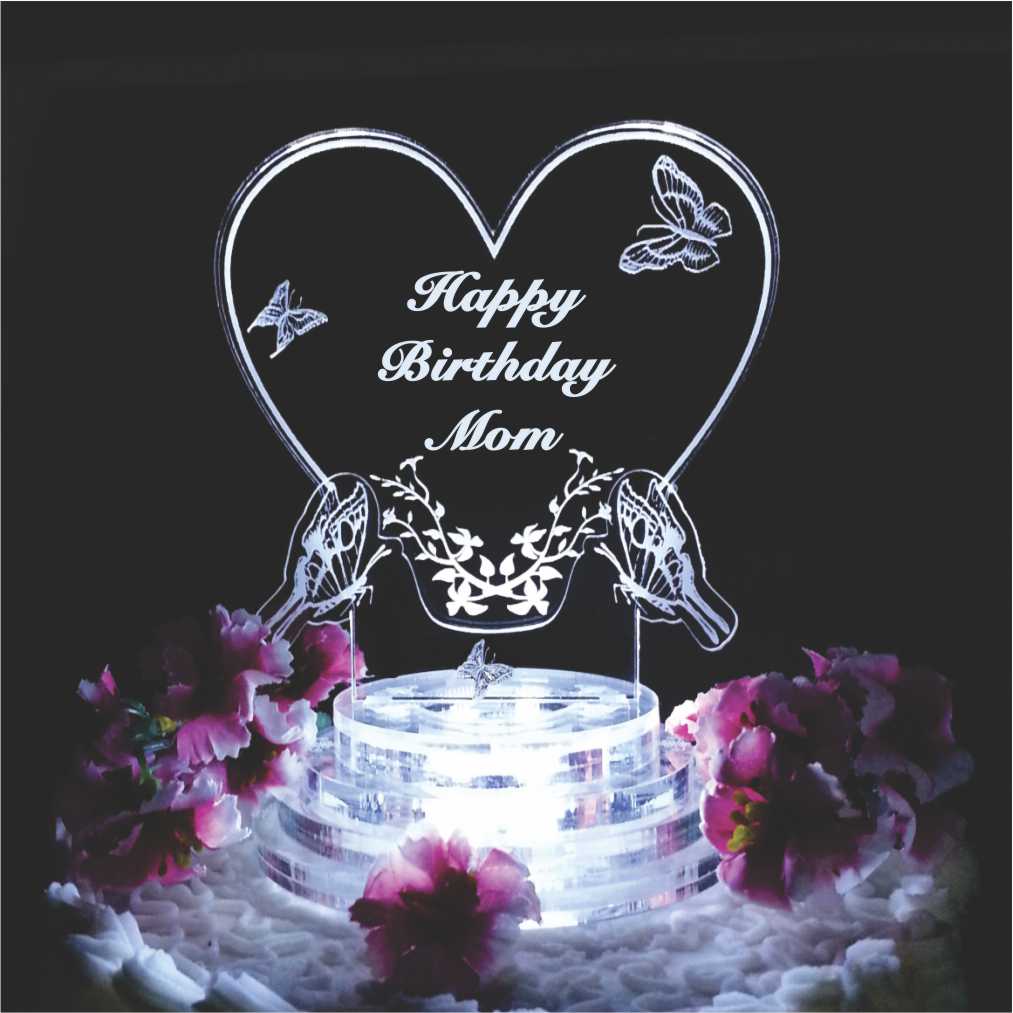 acrylic heart shaped cake topper with butterflies engraved along with Happy Birthday and name