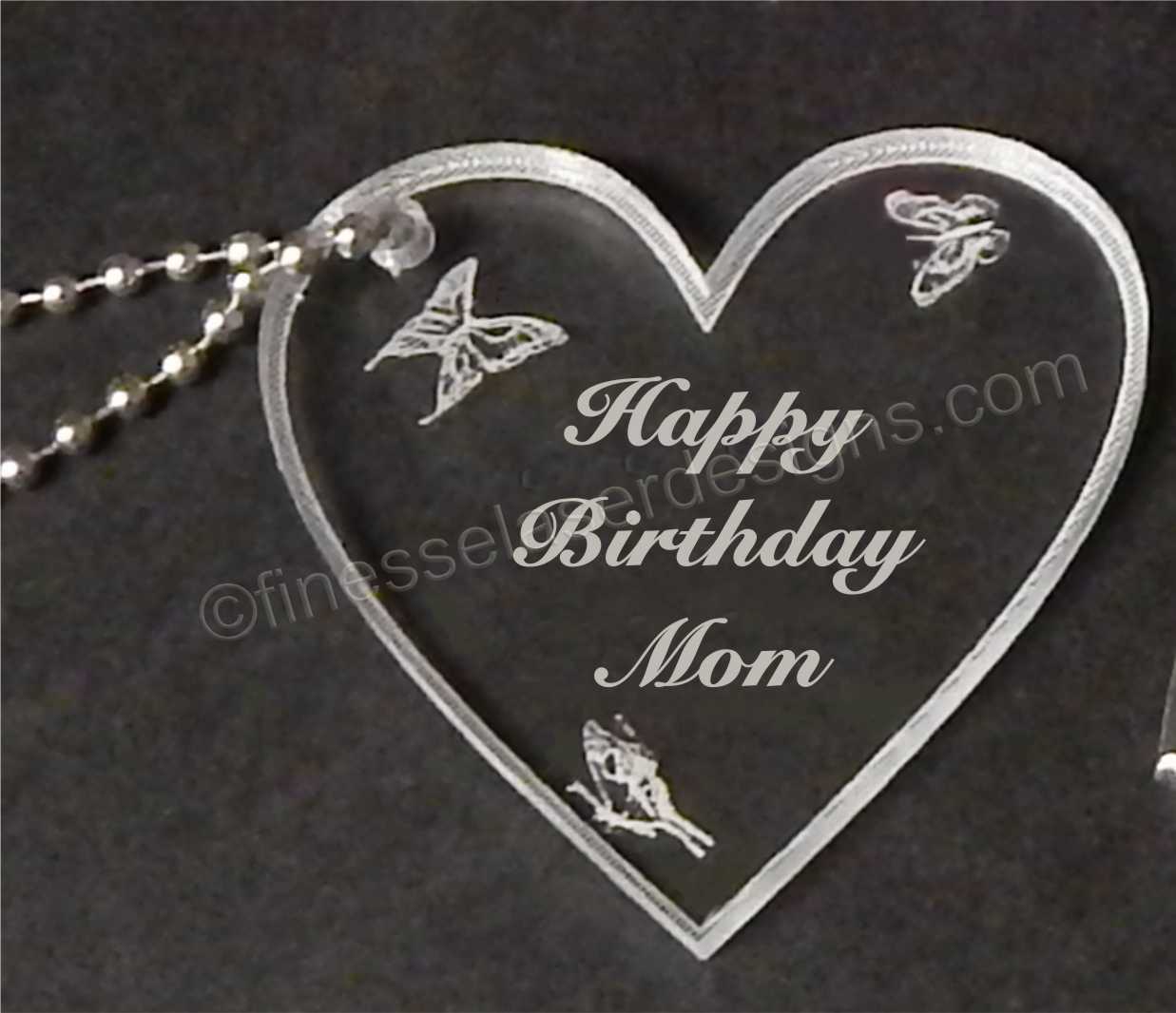 acrylic heart shaped keychain with butterflies and Happy Birthday with name engraved along with small metal chain attached