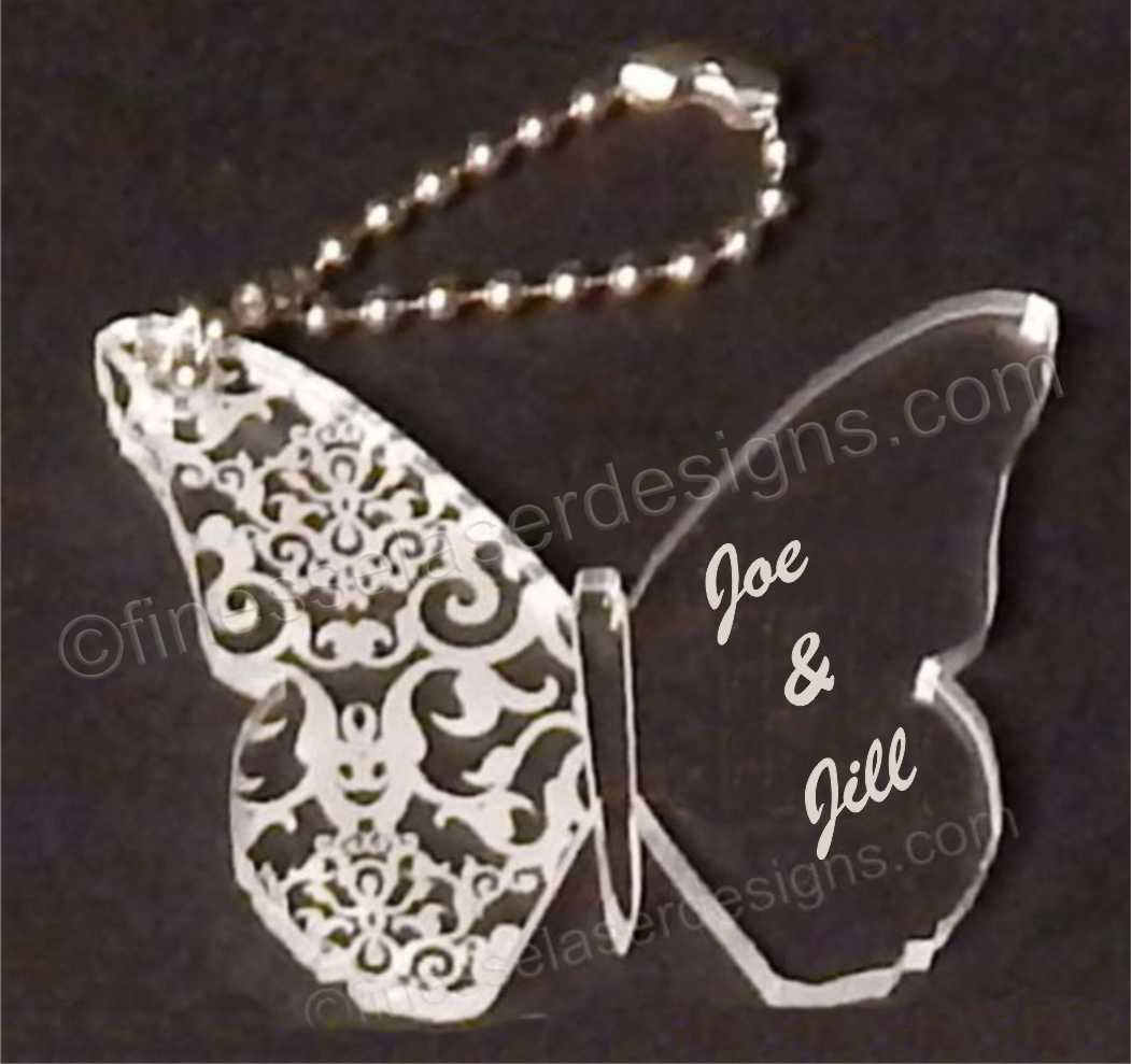 acrylic butterfly shaped keychain with names engraved along with small metal chain attached