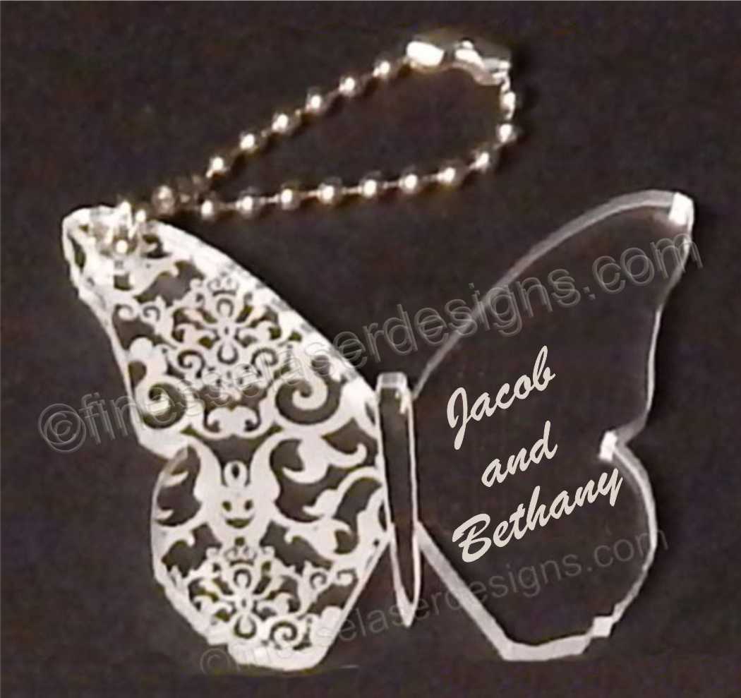 butterfly shaped keychain engraved with names and an attached metal chain