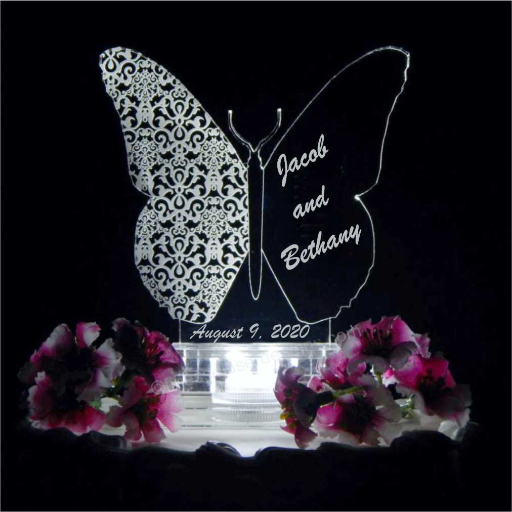 acrylic butterfly shaped cake topper engraved with name and date of wedding