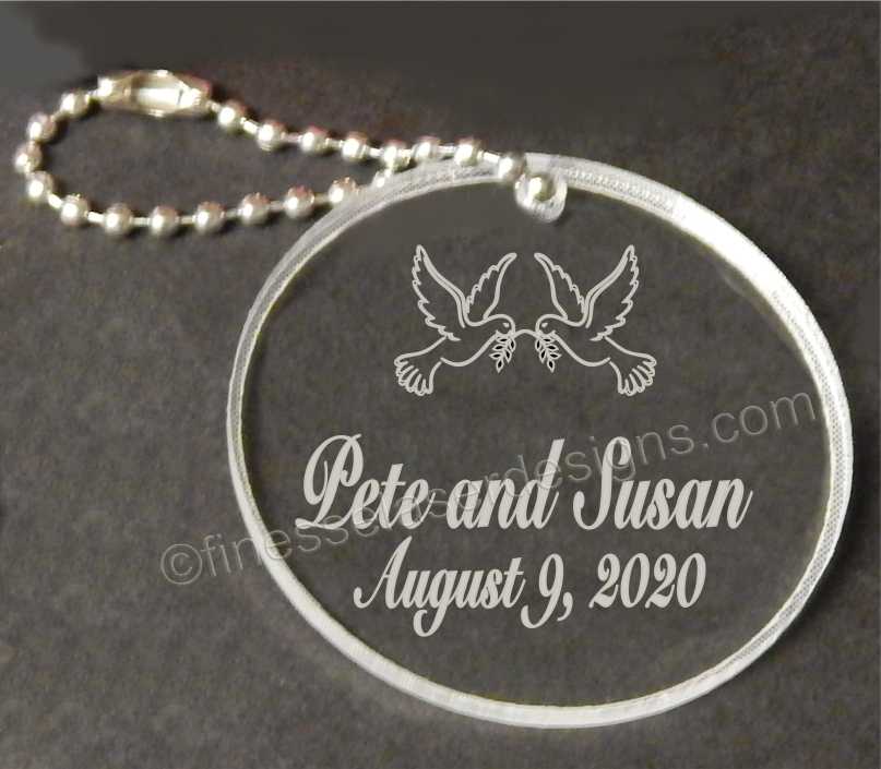 Acrylic round keychain designed with doves along with names and date
