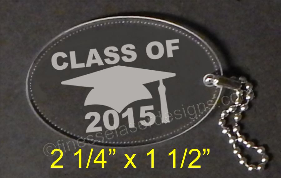 oval shaped acrylic keychain with graduation cap and Class of Year with attached small chain