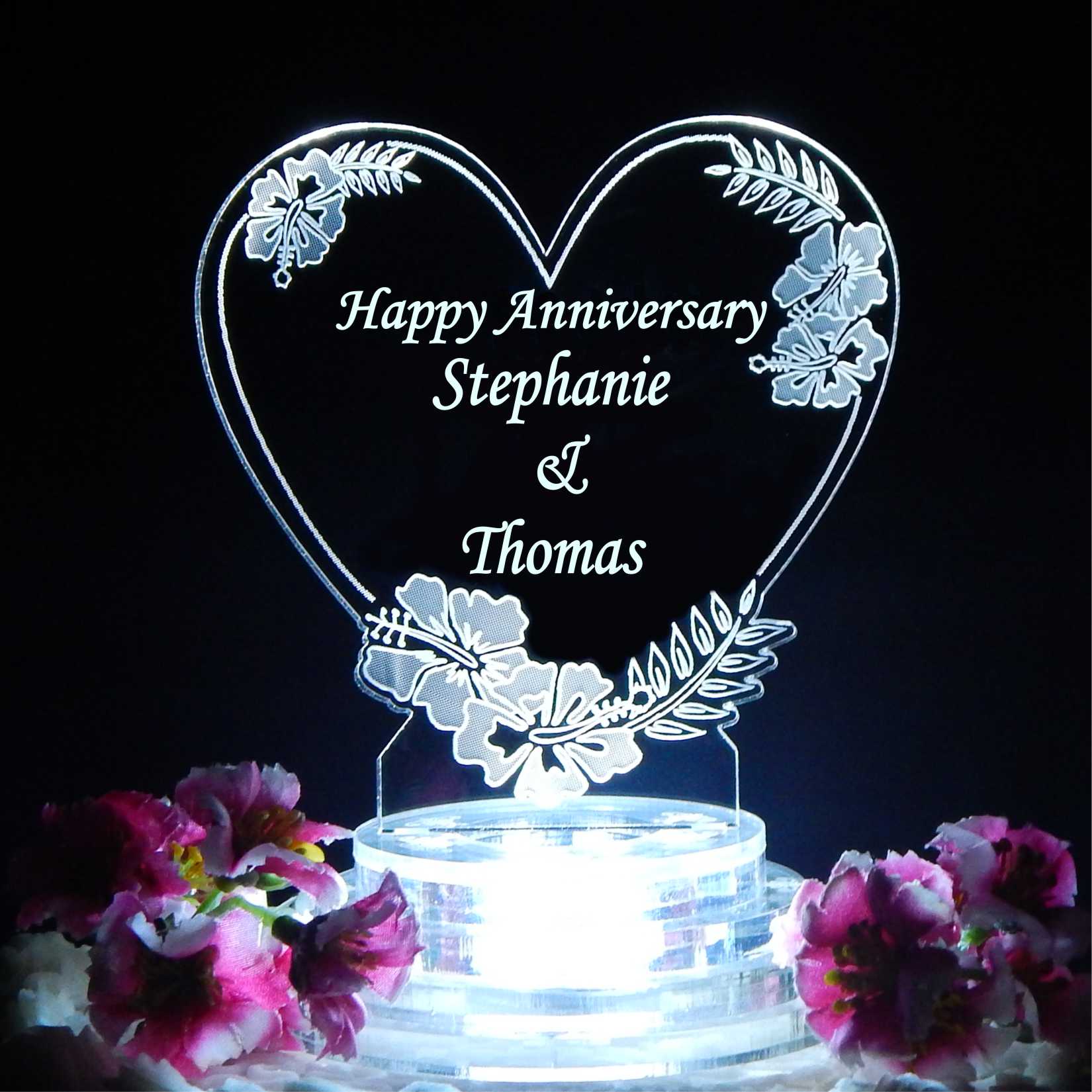 heart shaped cake topper with hibiscus flower design and Happy anniversary along with dates engraved
