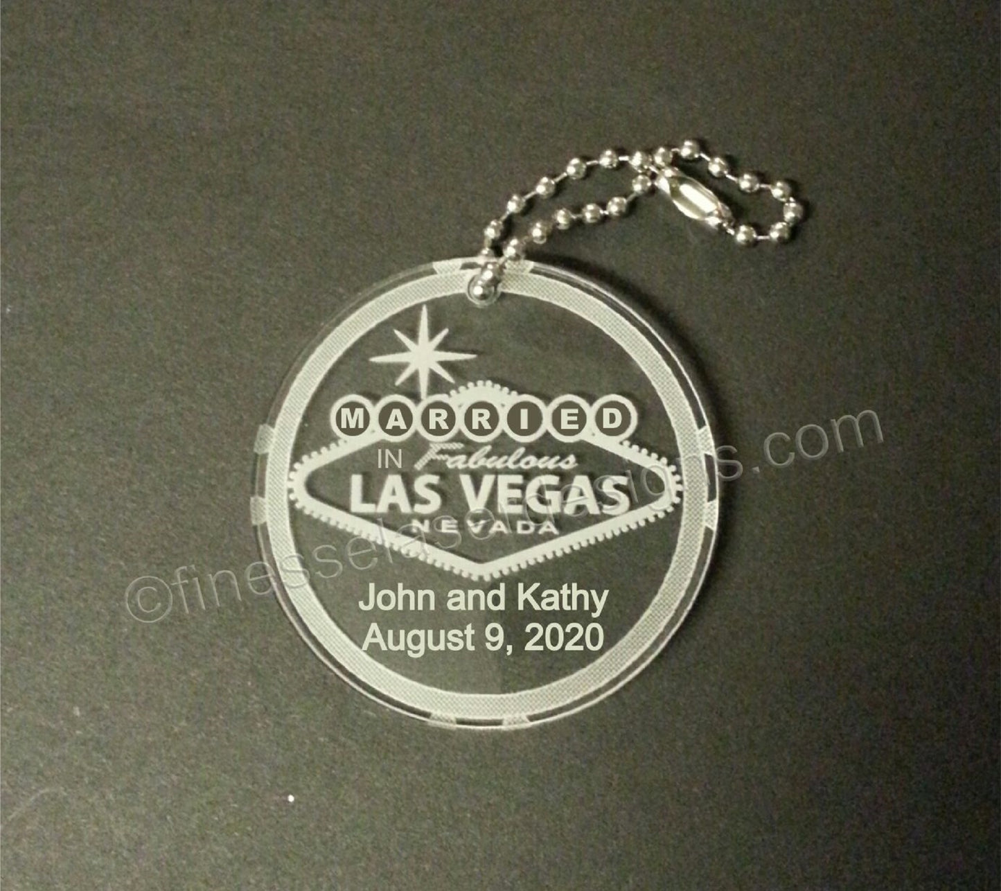 Married in Las Vegas round keychain along with names and date