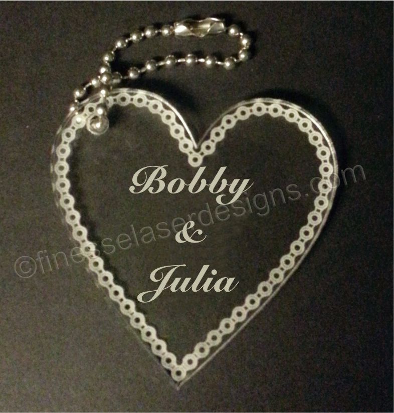 Acrylic heart shaped keychain with motorcycle chain border, names and metal chain attached