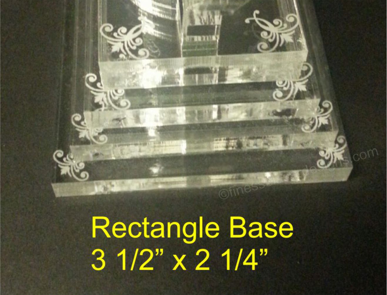 partial view of an acrylic tiered cake topper base