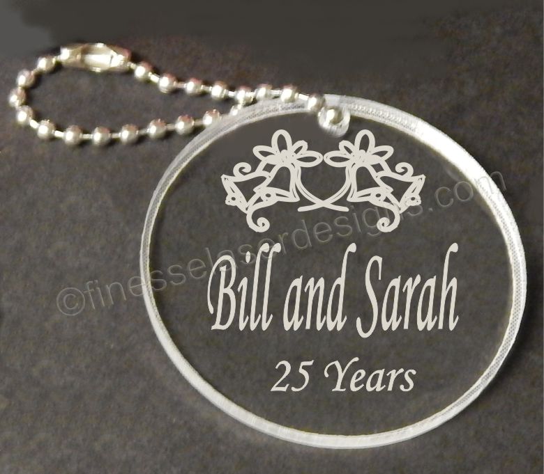 round acrylic keychain decorated with wedding bells, names and number of anniversary years
